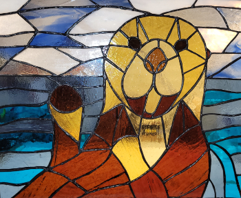 Happy Otter stained glass piece